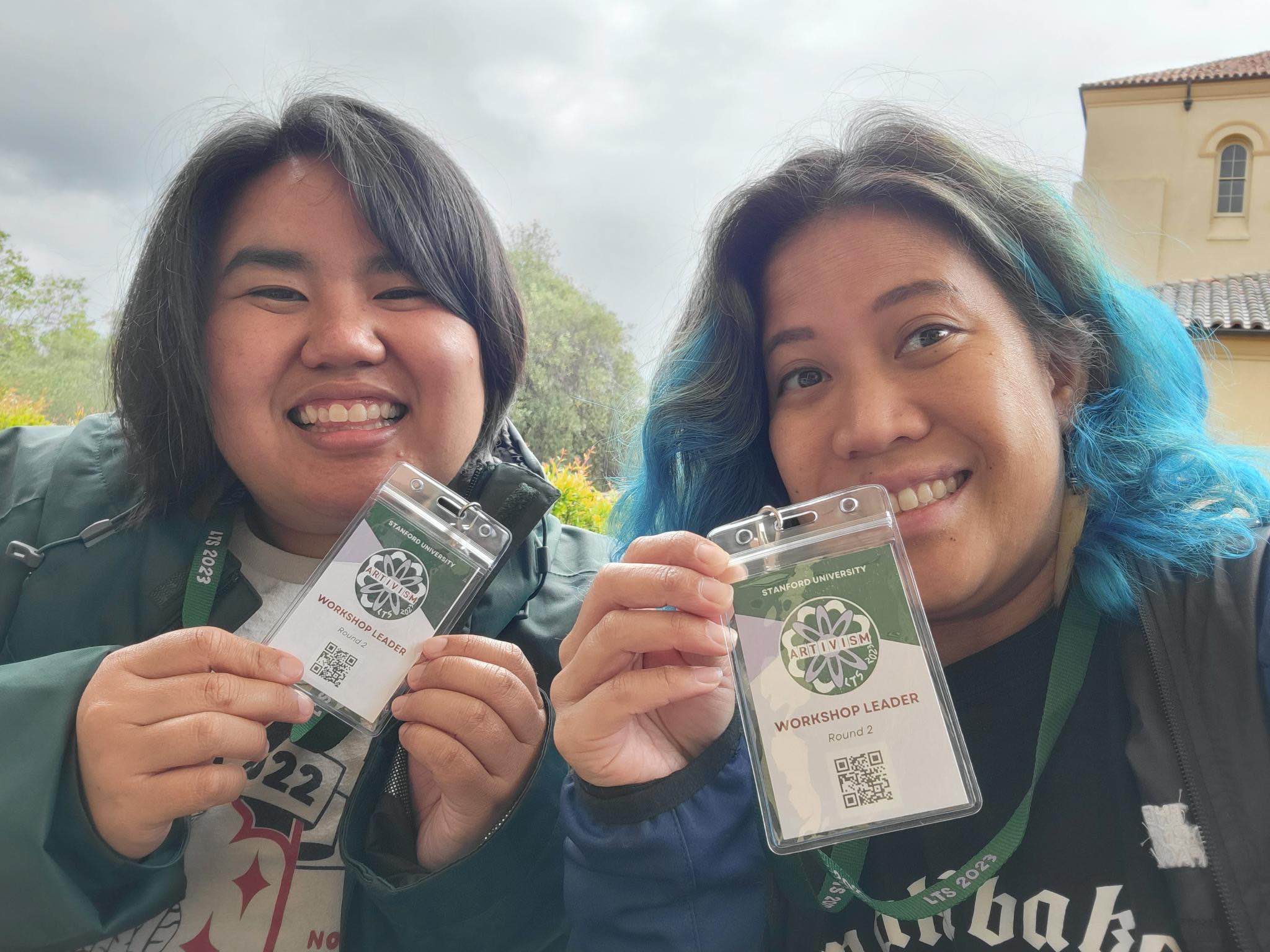 justher and noemi holding up badges from that conference